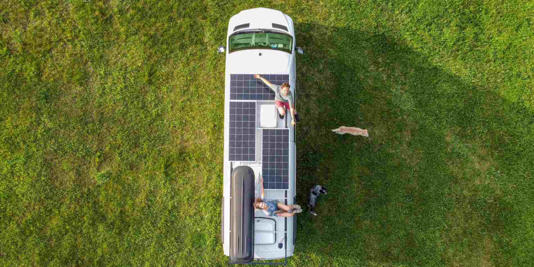 An RV installing solar panels for off-grid living