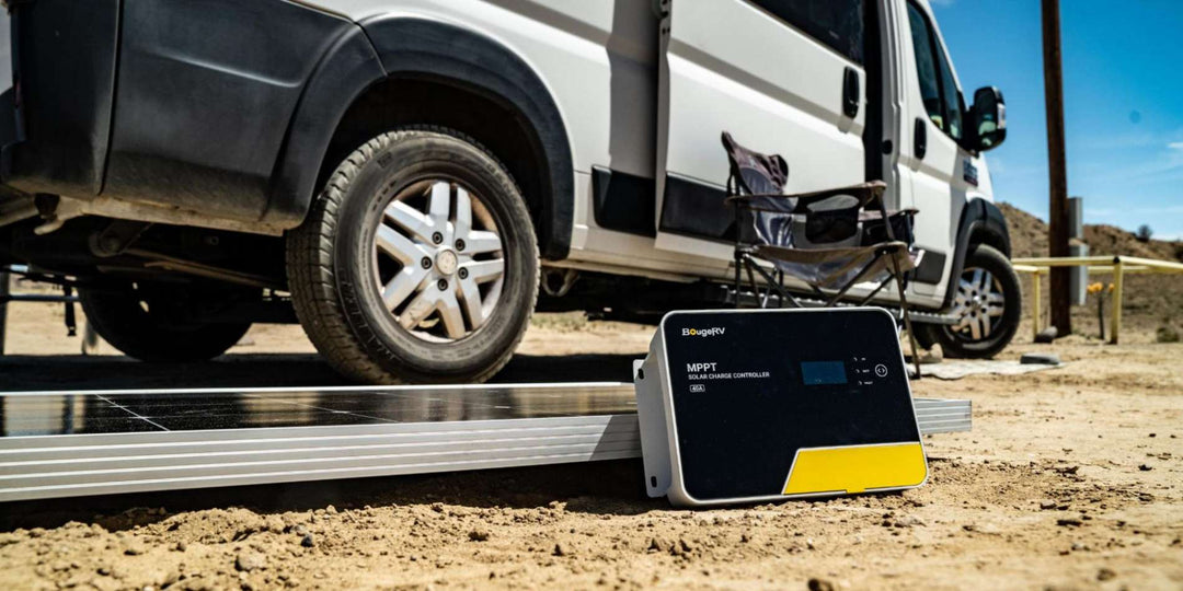 BougeRV’s 40A MPPT charge controllers on the floor in front of an RV