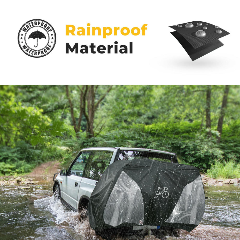 A car covered with a rainproof bike cover in a forest setting